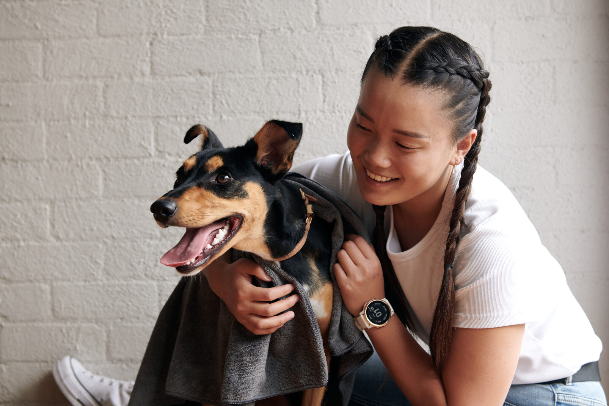 Girl cuddling rescue dog for National Pet Adoption Month campaign by PetStock