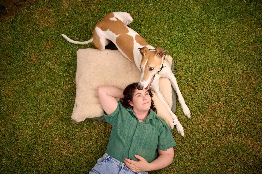 Richard and owner Darcy on grass for pet adoption myths debunkes