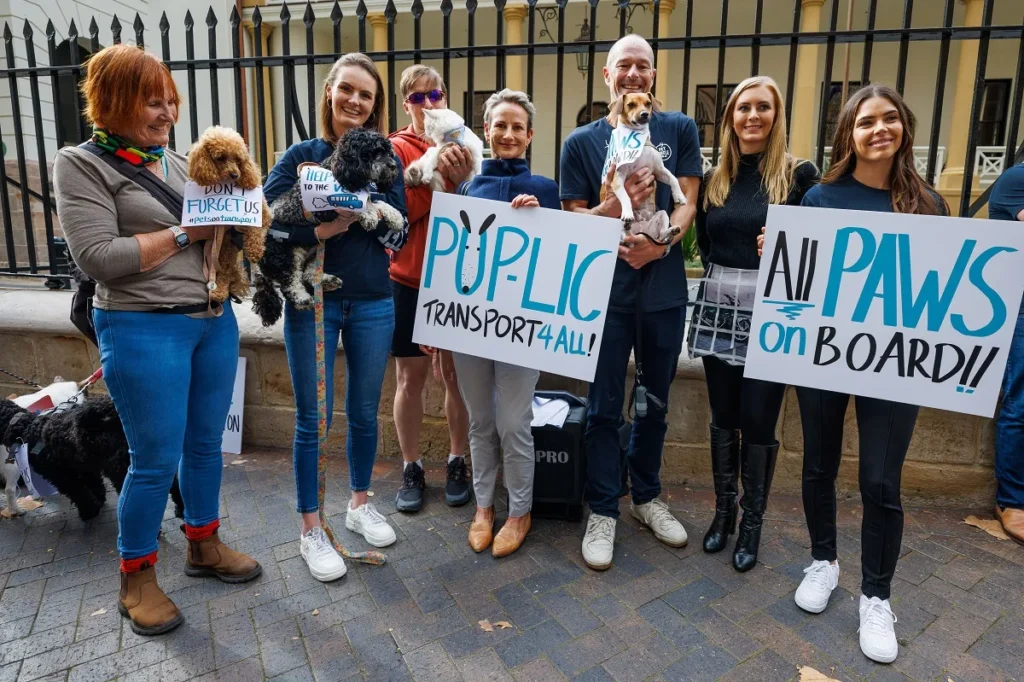 A group of people and their pets outside Parliament House in Sydney recently for the Pet Circle pet protest to allow pets on public transport 
