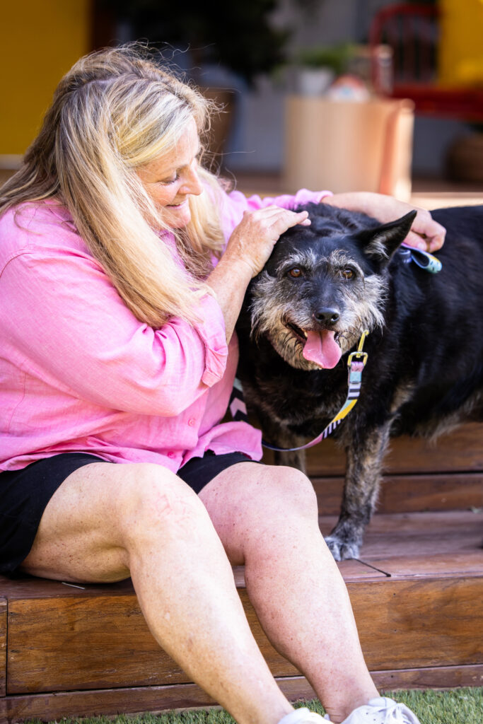 Shelter animal and woman embrace after she adopted him on the show