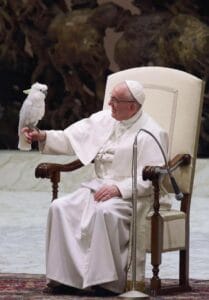 Pope Francis with a cockatoo for article remembering pope Francis legacy to animals